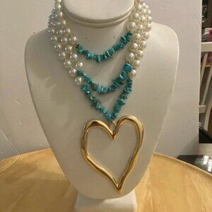 PEARL NECKLACE WITH  HEART ON DISPLAY